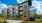 Exterior view of apartment building with brick sign next to it at Trailside at Reedy Point in Greenville, SC